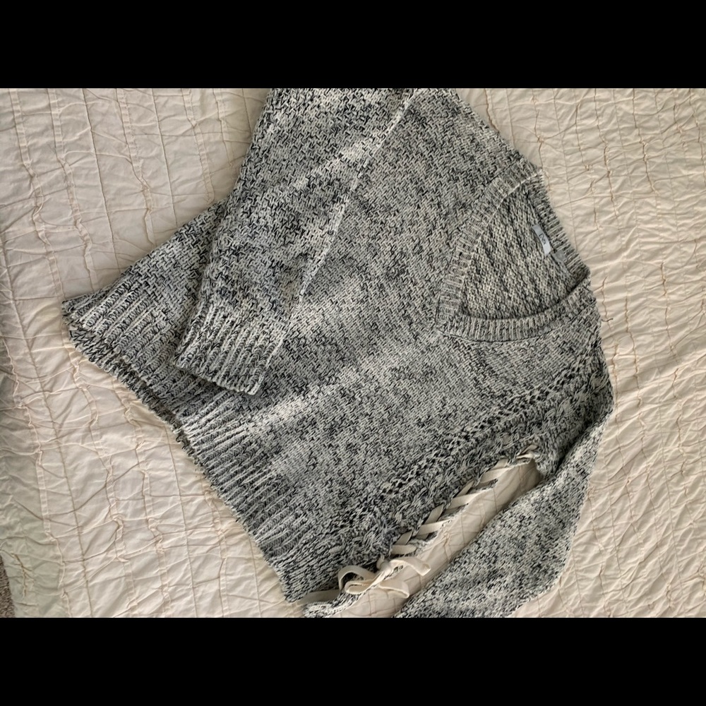 Knit sweater with side lacing detail